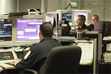 Dispatchers take calls at the Camden County Communications Center in Lindenwold. The county's signal has been disrupted by a Boston TV station. AVI STEINHARDT/Courier-Post